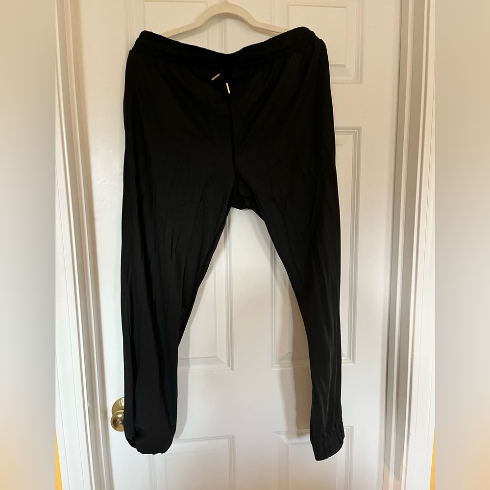 Black Joggers w gold zipper. NWT